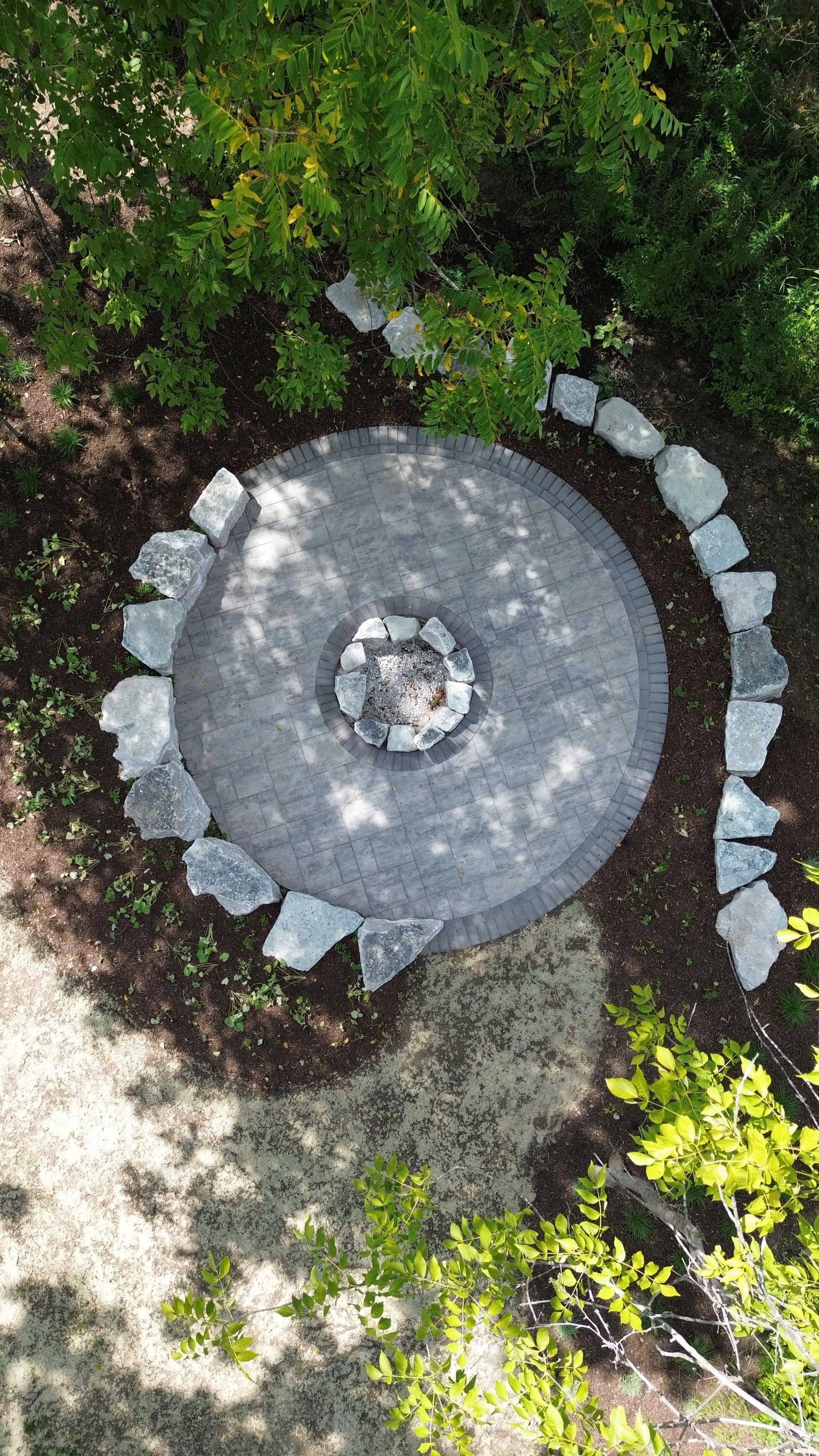 Project Unilock Paver Patio with Limestone Boulder Fire Pit Area in Troy Ohio image