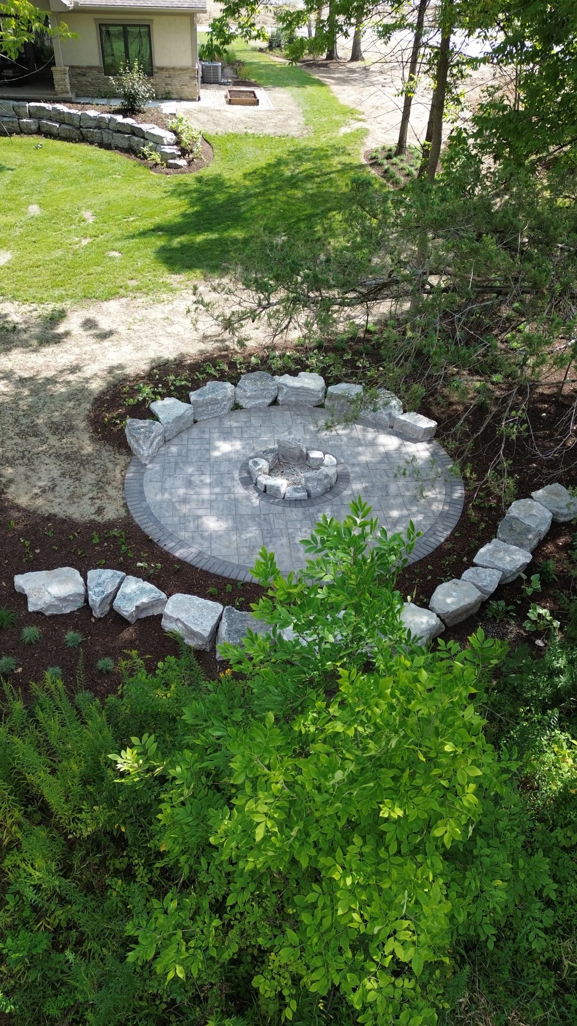Gallery photos for Unilock Paver Patio with Limestone Boulder Fire Pit Area in Troy Ohio: Image #1