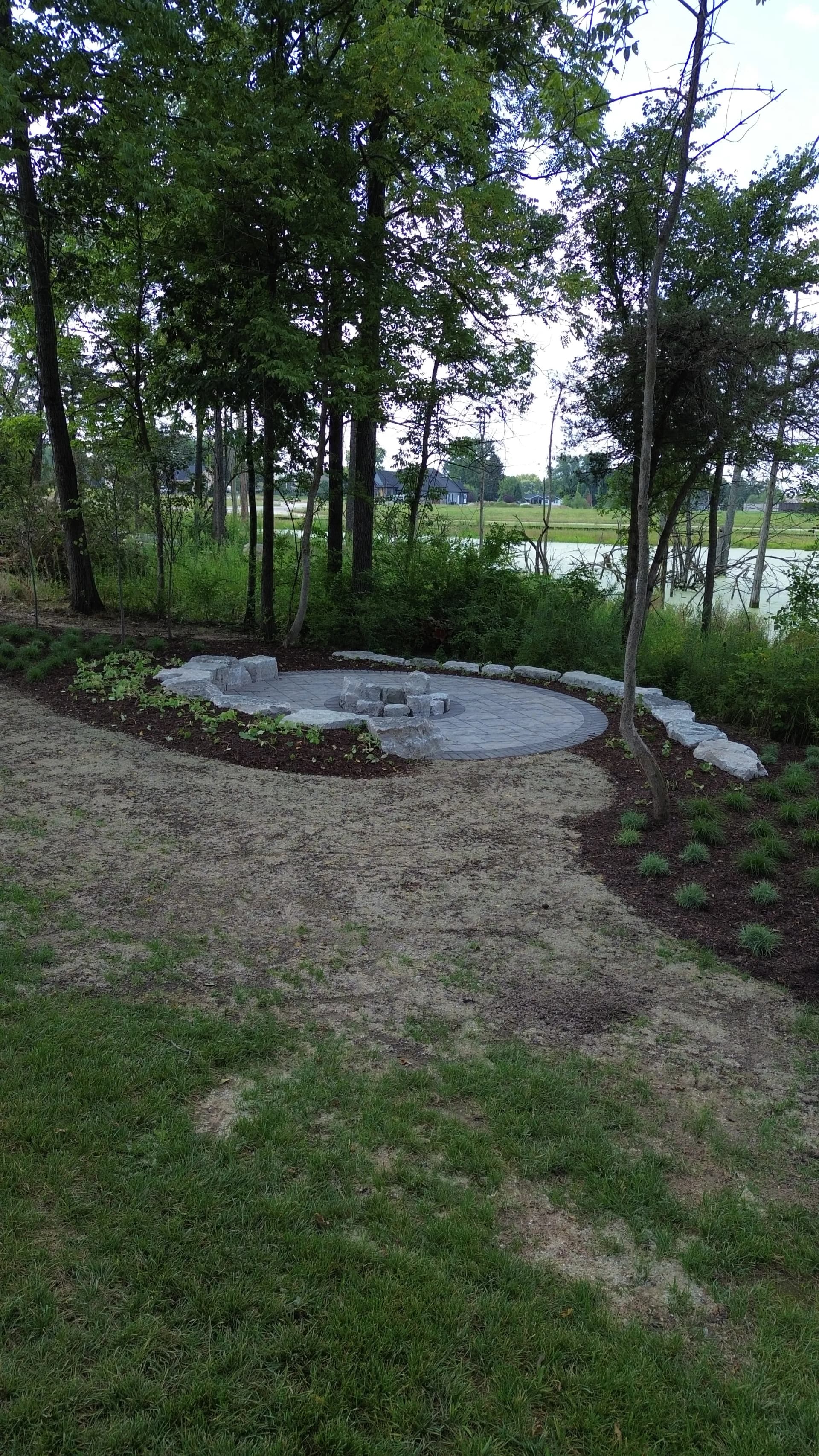 Gallery photos for Unilock Paver Patio with Limestone Boulder Fire Pit Area in Troy Ohio: Image #2