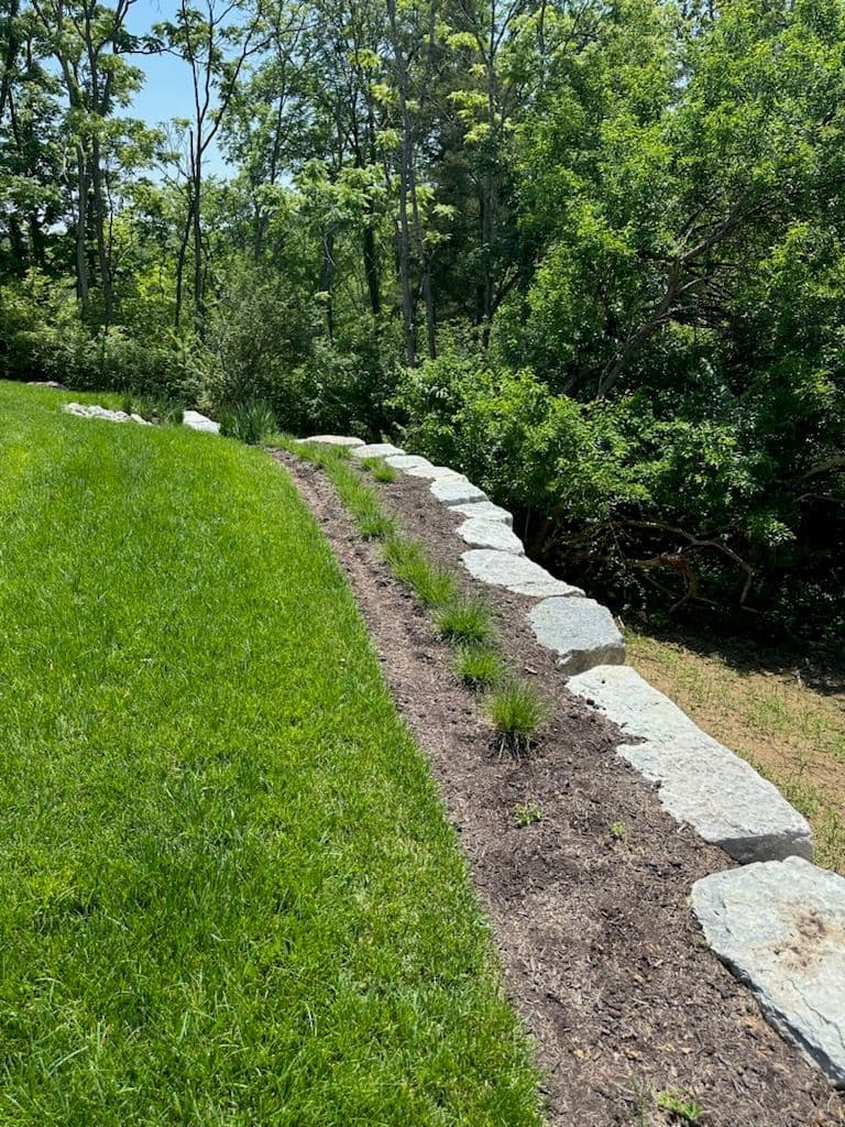 Stunning Boulder Wall and Lush Turf Transformation image