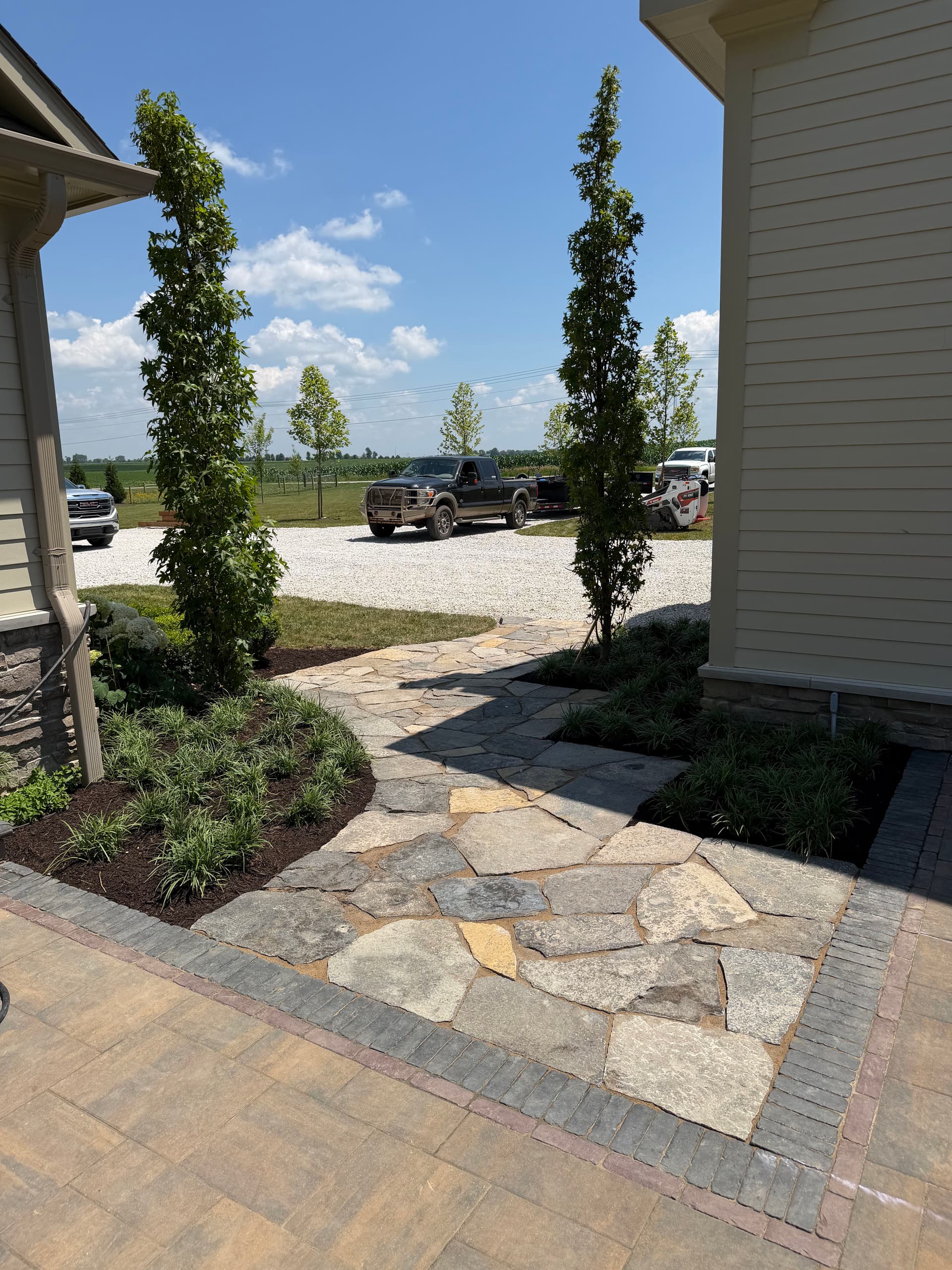 Natural Stone Walkways, Garden Beds and Fresh Plantings Done Right image