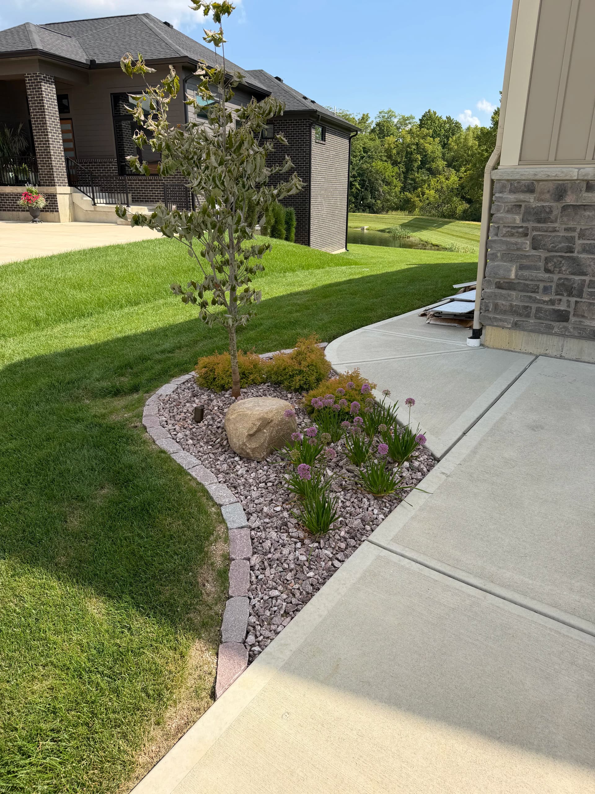 Gallery photos for Stone Edging, Fresh Plantings and Rock Beds in Centerville: Image #1